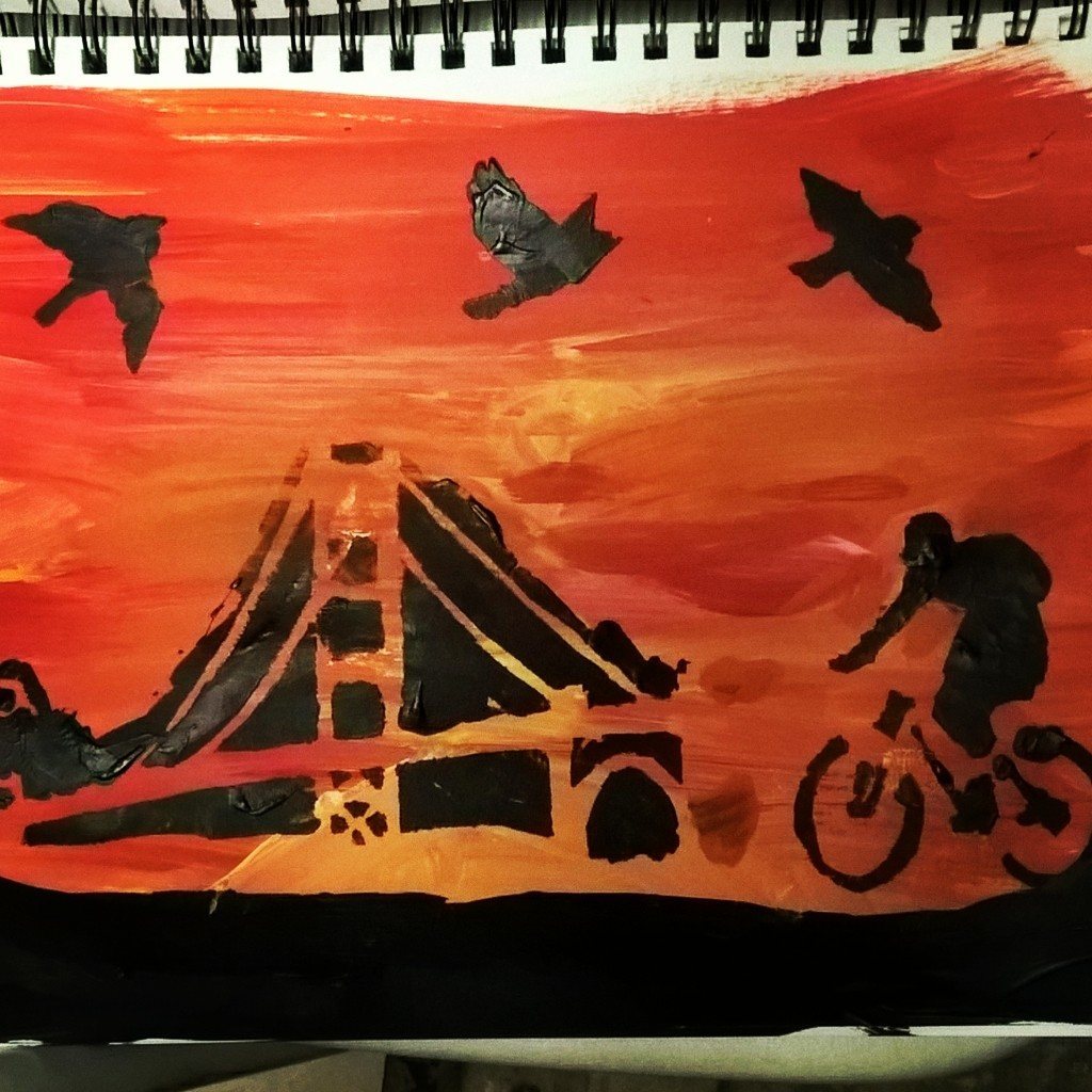 sunset sky with silhouettes of bridge and bike and birds