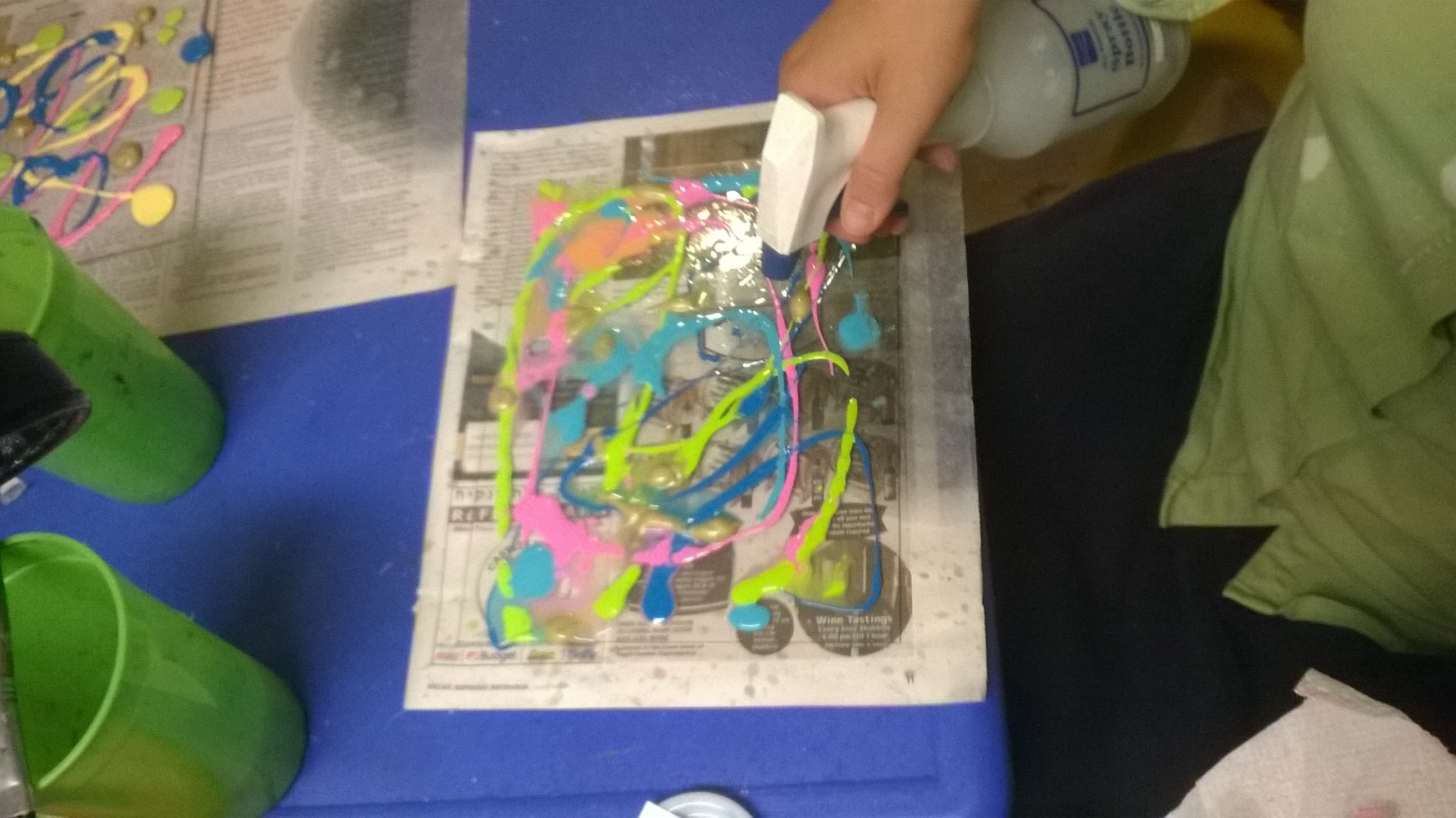 spritzing dimensioanl paint onto plexiglass