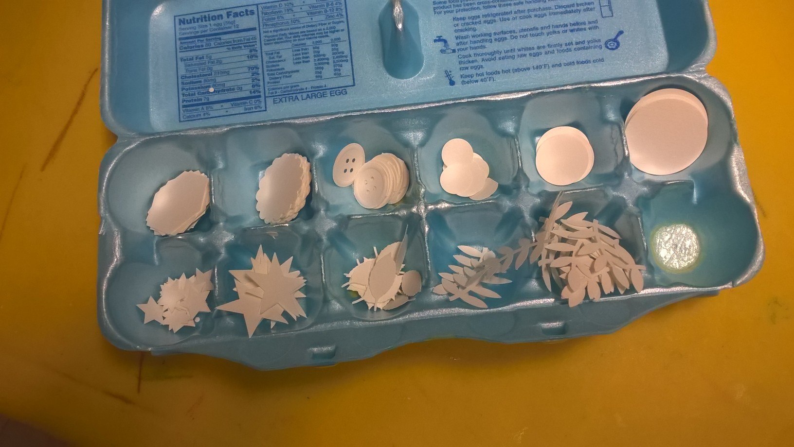 craft punch pieces in eggbox