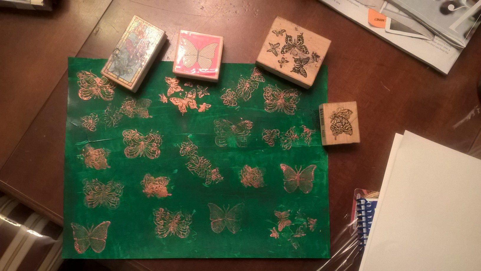 gold stamped butterflies over green background