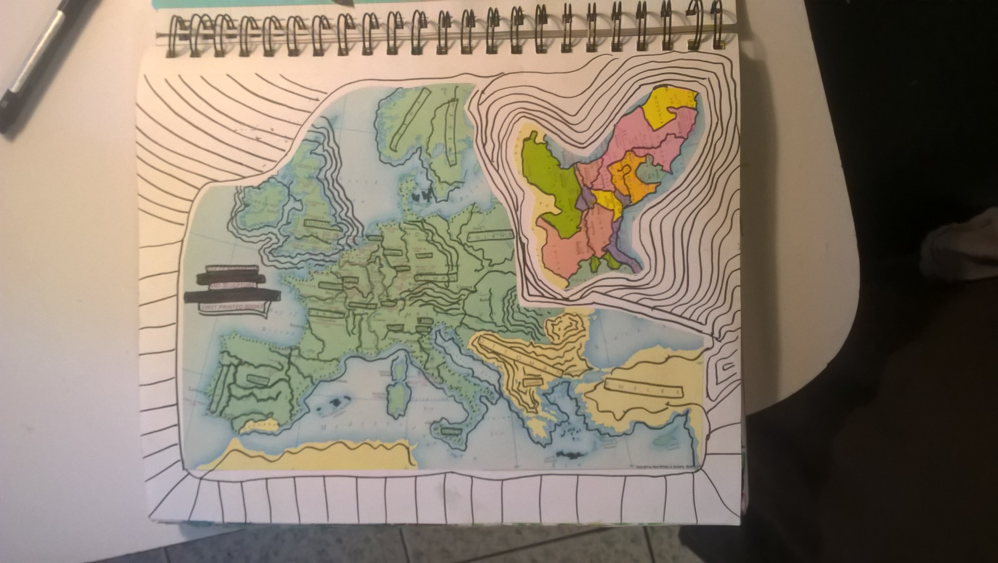 collage of map onto journal page with doodles added