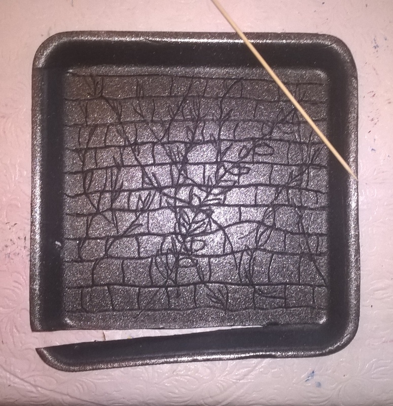 drawing on styrofoam tray with skewer