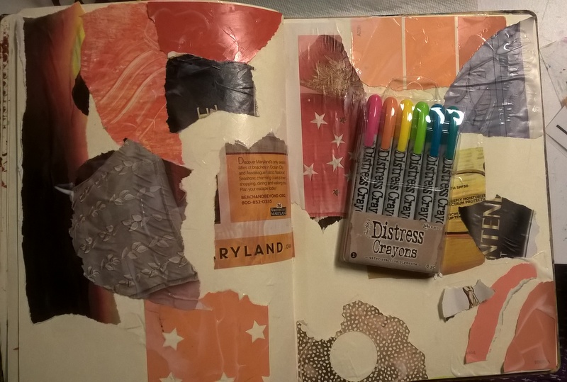 collage pieces on journal page ready for distress crayons