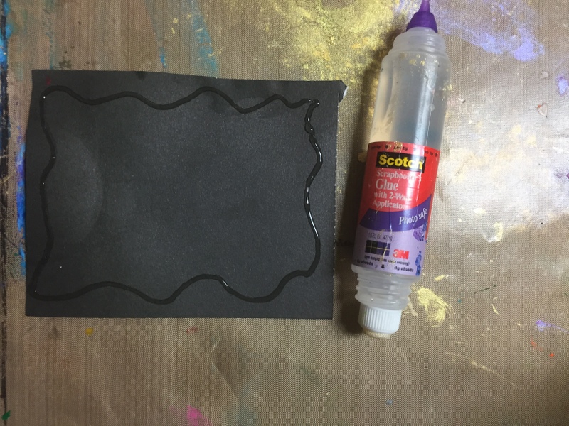 liquid glue and black paper