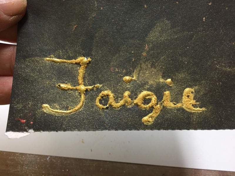 word covered with pigment powder