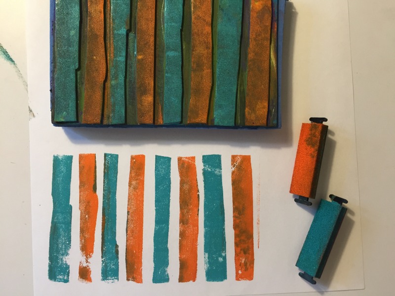 orange and turquoise ink on homemade striped foam stamp